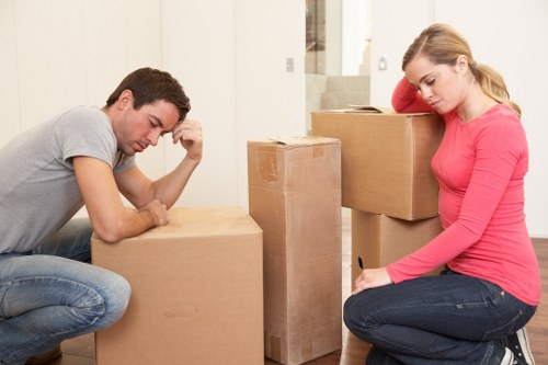 Local removal van loading furniture near central London streets